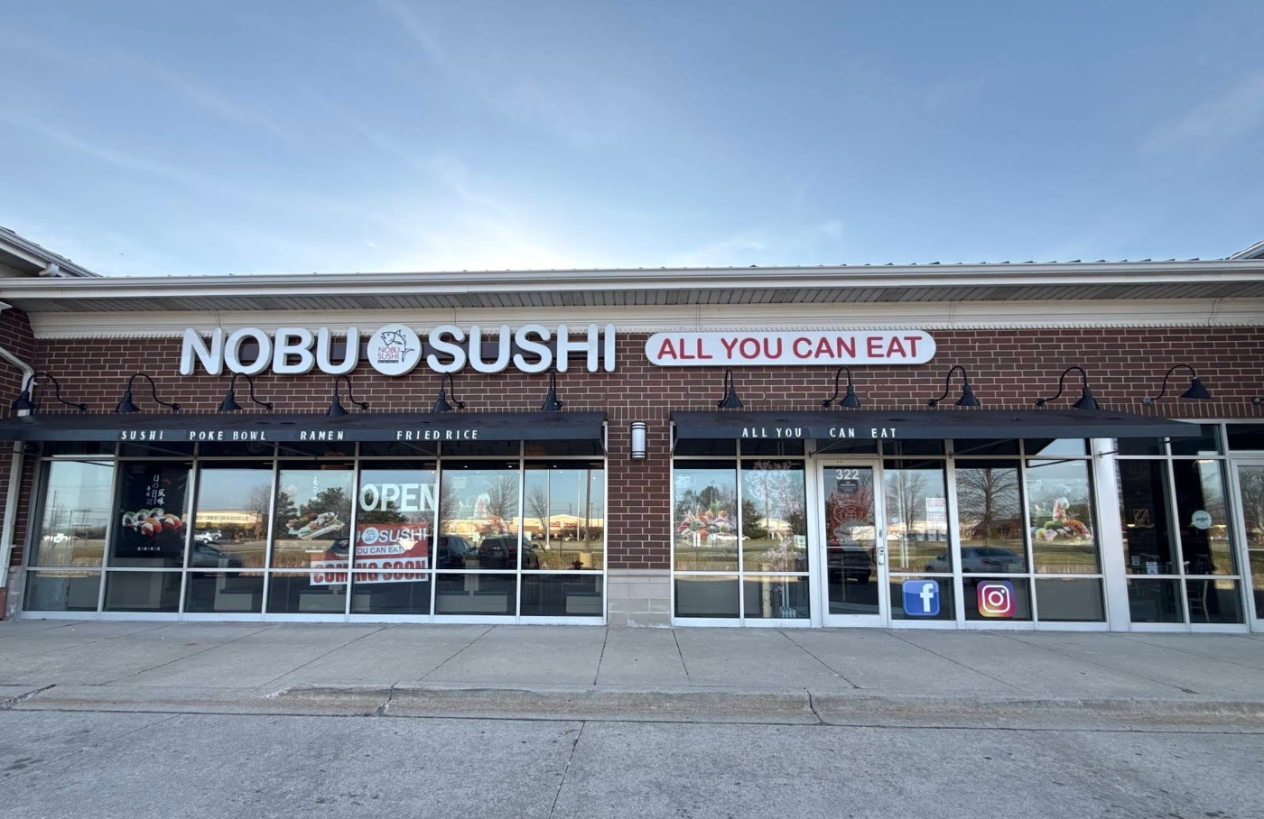 The Nubo Sushi storefront on Randall Road in South Elgin, Illinois at dusk.